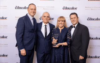 A photo showing the Southern Cross Catholic College in Burwood team with their award